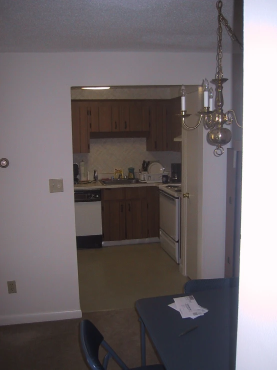 a kitchen with a table and a sink next to it