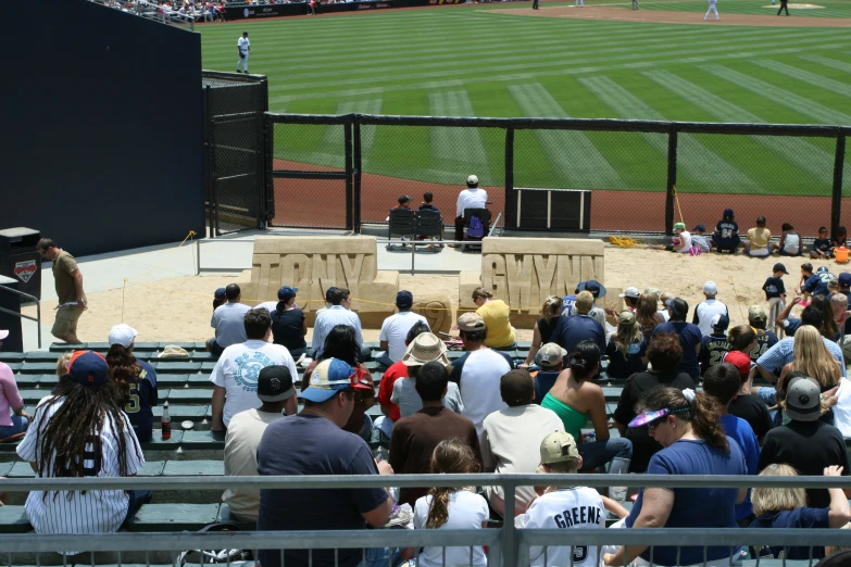 a crowd of people watching a baseball game