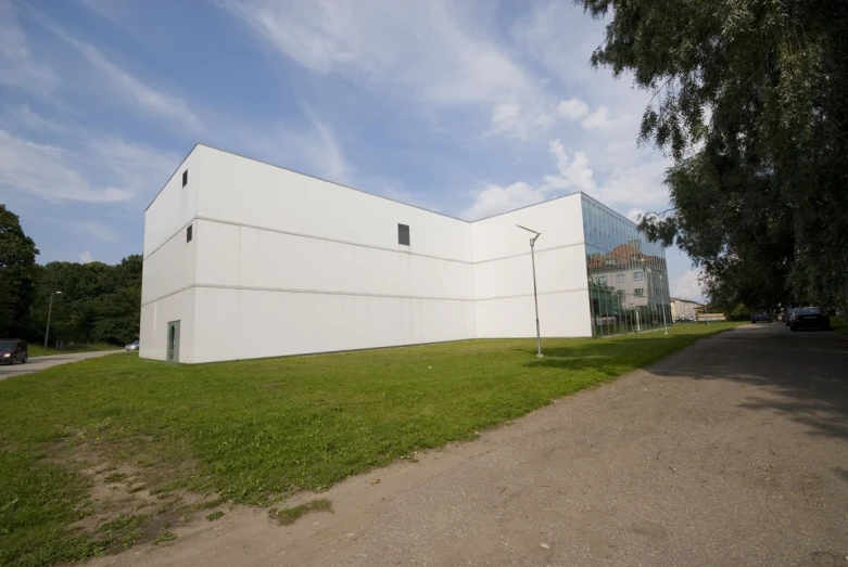 large building sitting on the side of a road