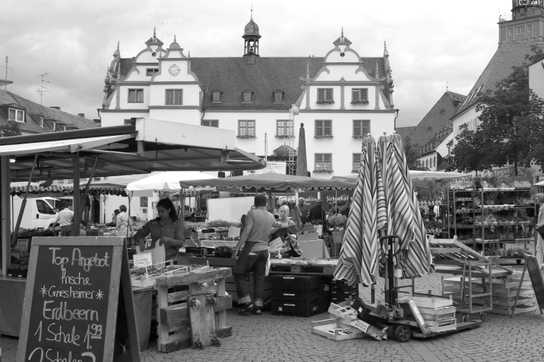 black and white pograph of market in city center