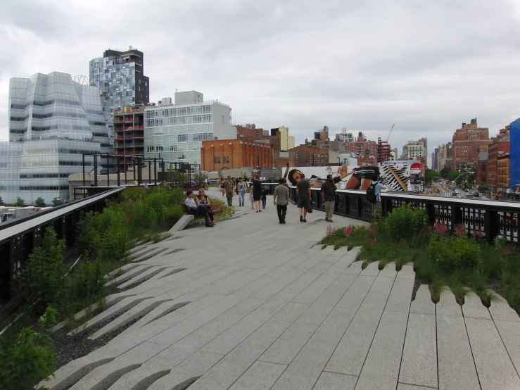 people are walking up and down the elevated walkway