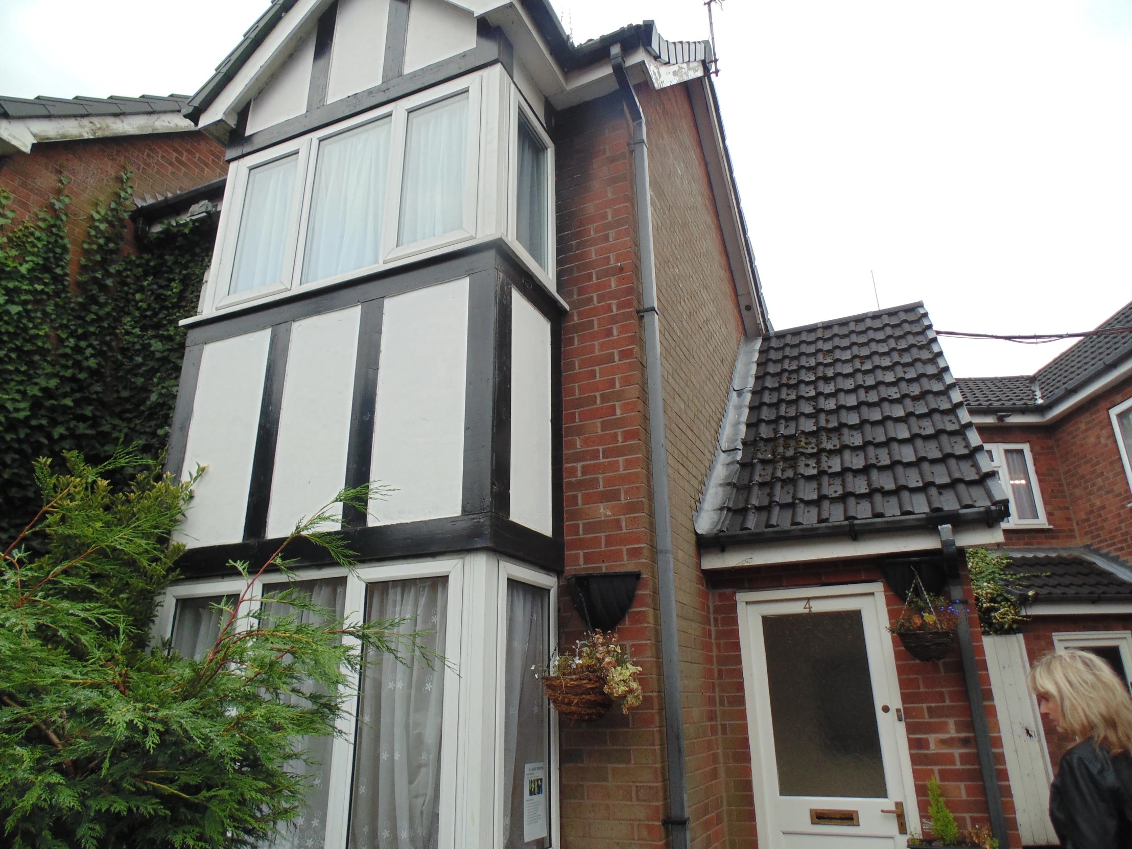 the side of a house with white and black trim