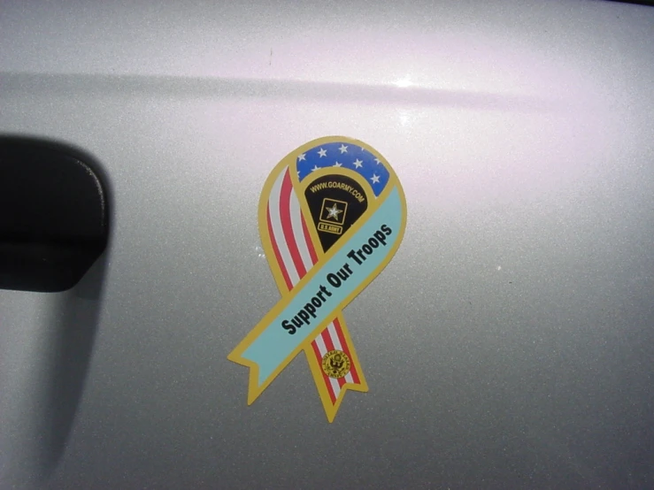 the car door is decorated with an american flag ribbon