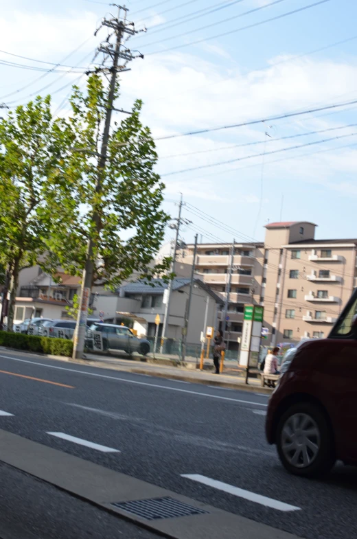 a red car that is sitting in the street