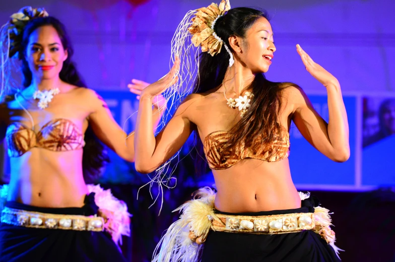 women in colorful outfits on stage dancing