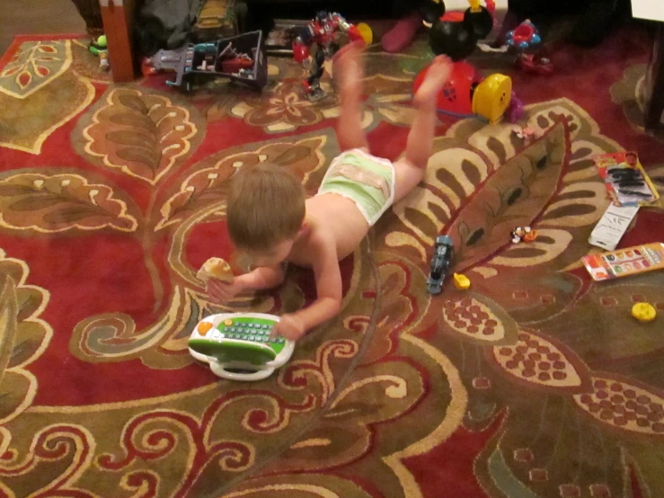 a toddler plays with toys on the rug