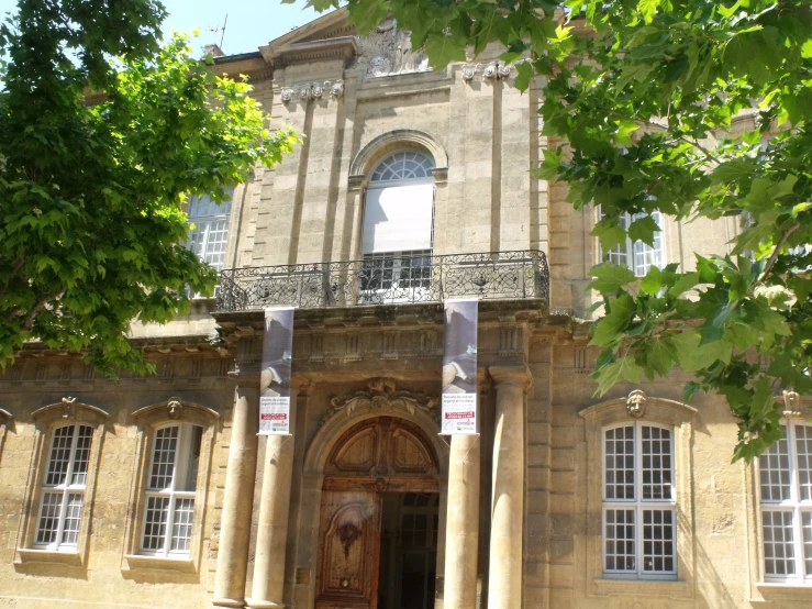 an old building with tall arches and arched windows