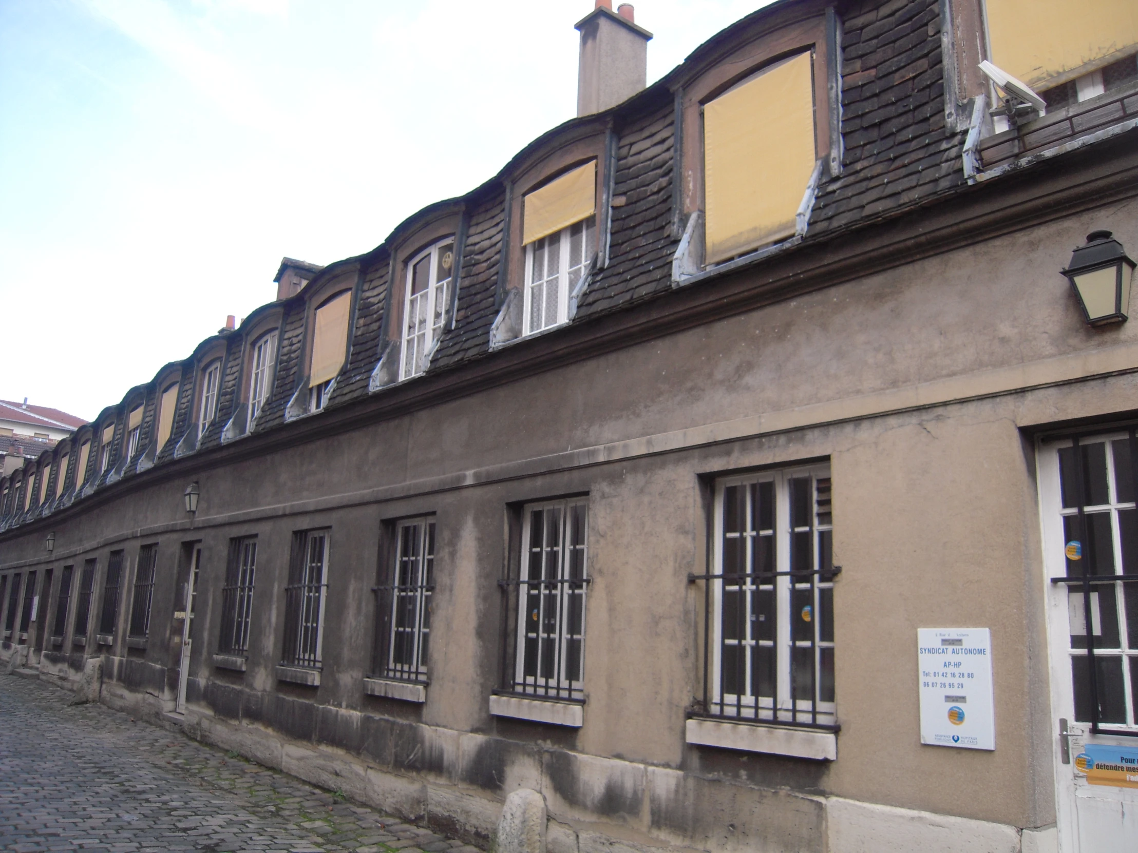 a building with windows and a sky background