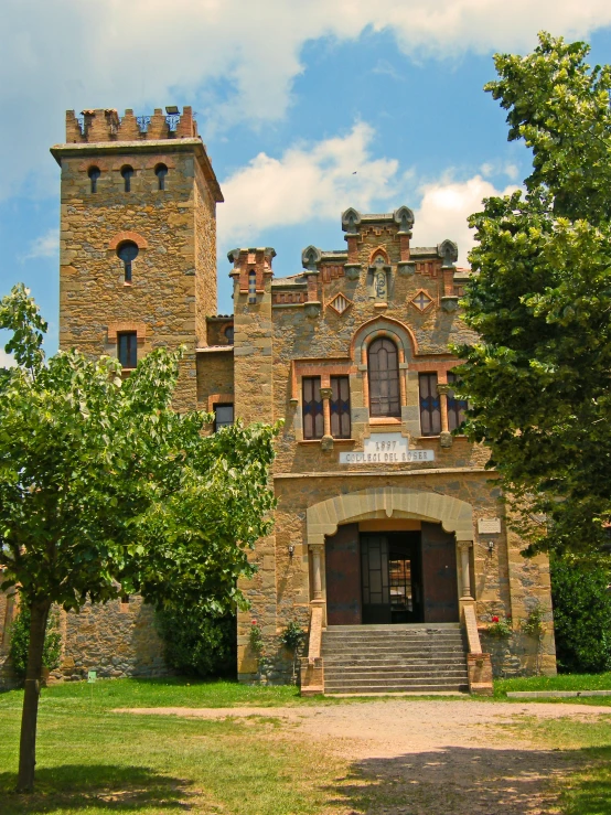 a large brown building with a clock tower