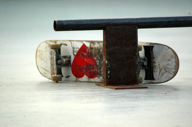 a skateboard that has been knocked over and is upside down