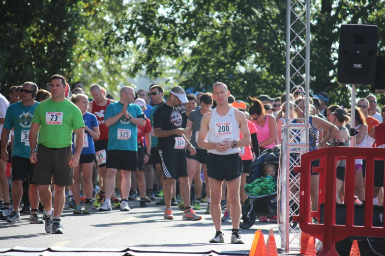 people are standing at the finish line