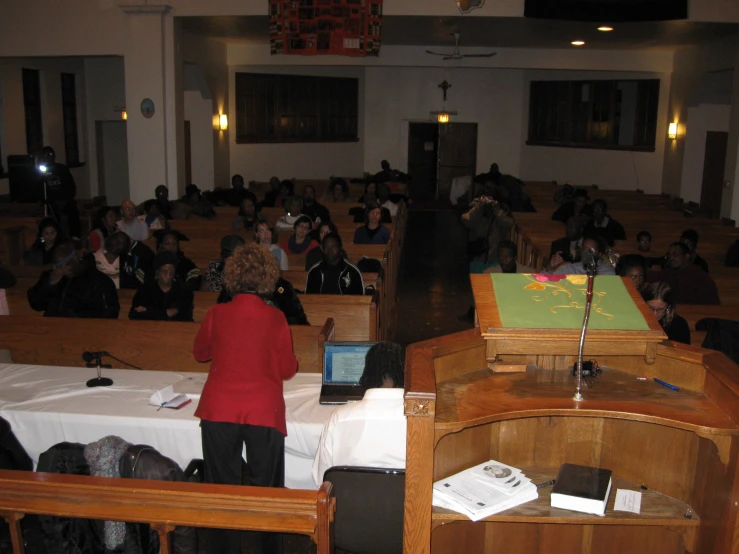 the room is full of students who are attending a meeting