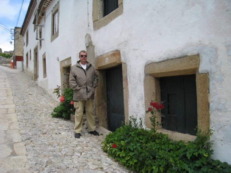 a man standing in front of a building