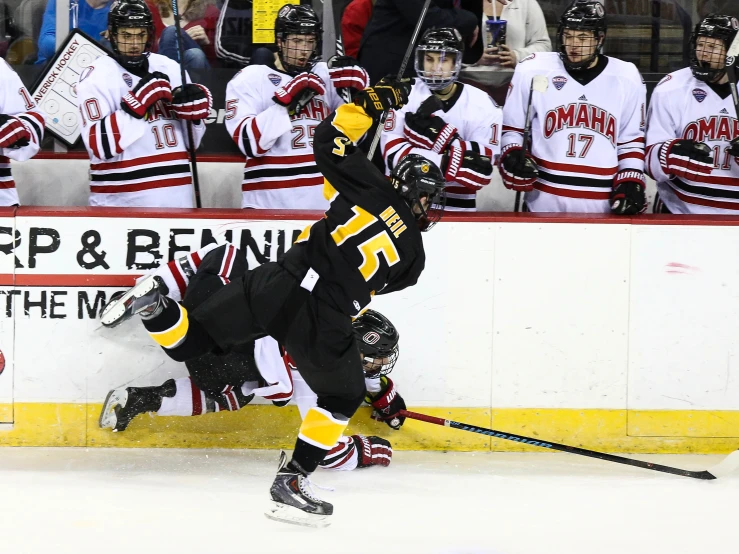 a hockey player tries to grab the ball