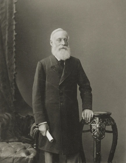 old pograph of a bearded gentleman in a suit and tie