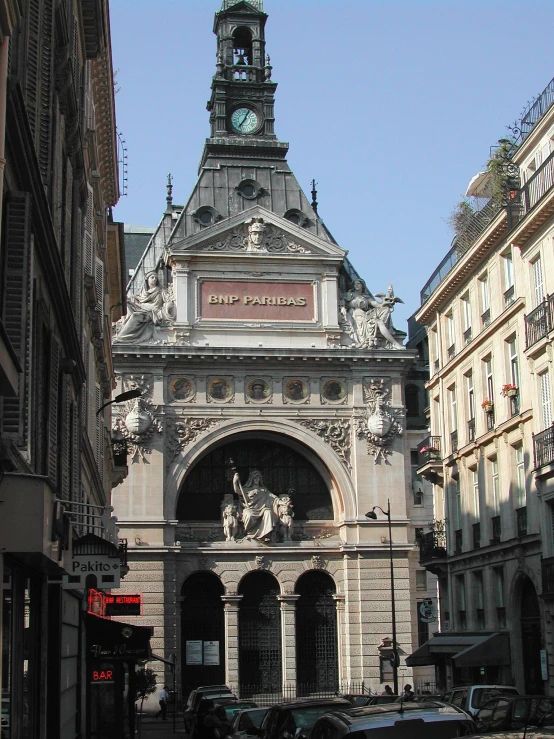 a tower that is above a building on a street