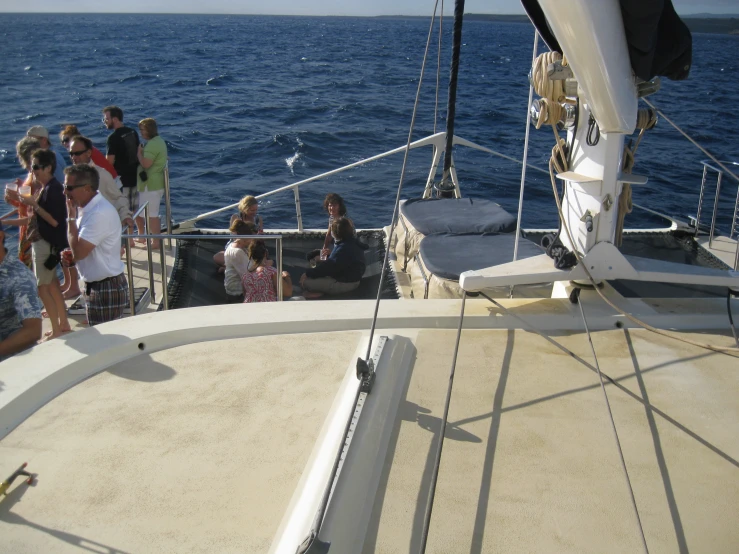 group of people on a boat on the ocean