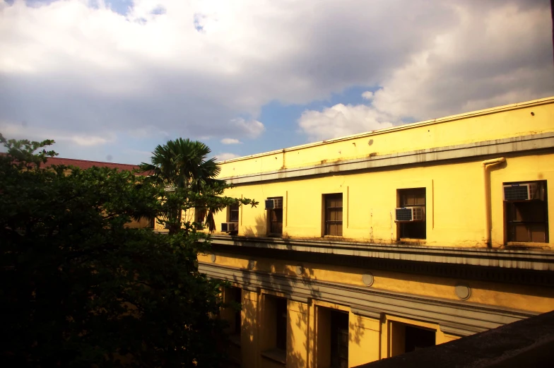 an old building next to the tree