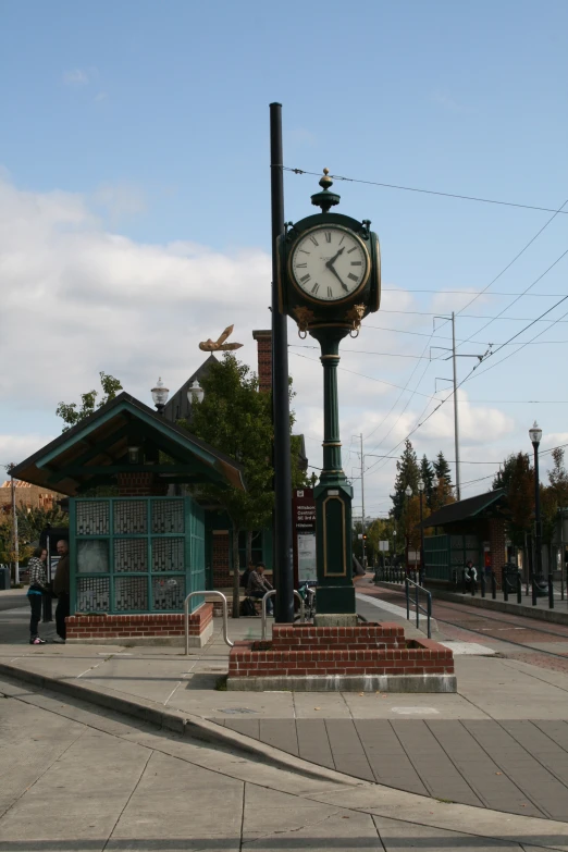 a large clock sitting on top of a pole