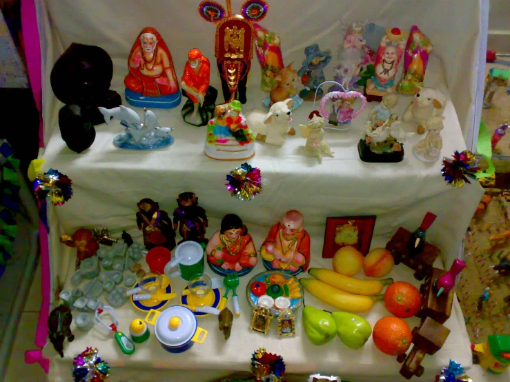 there are figurines displayed on a table that is on display