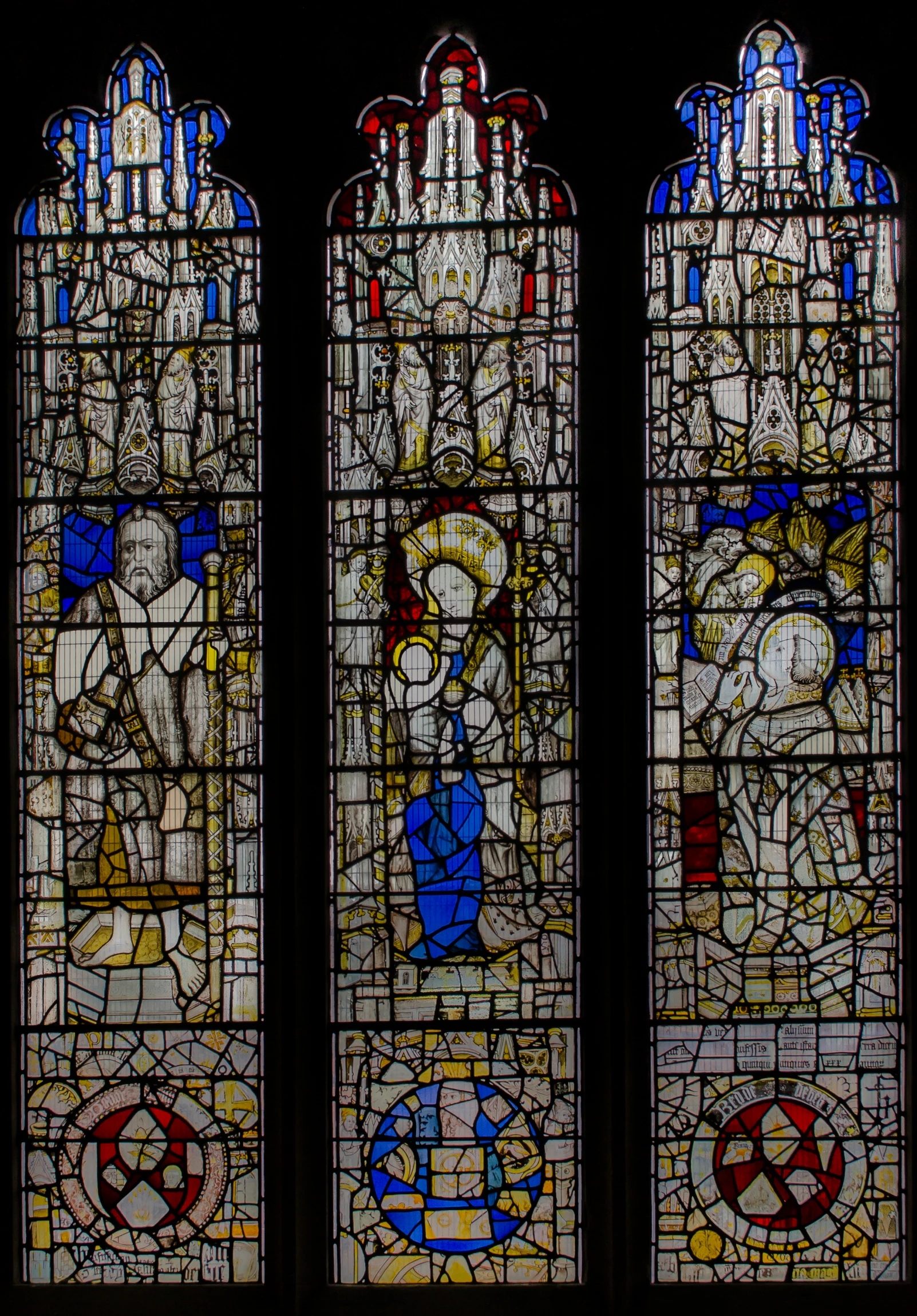 two stained glass windows, one in the center and one with angels