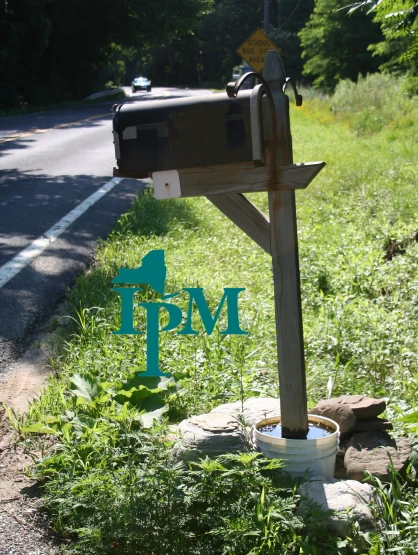 an mailbox is on the side of the road