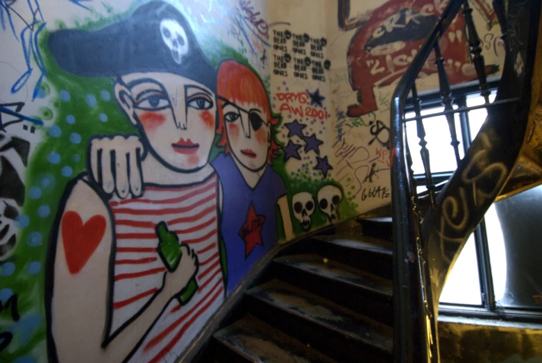 graffiti is shown on the wall and the stairs