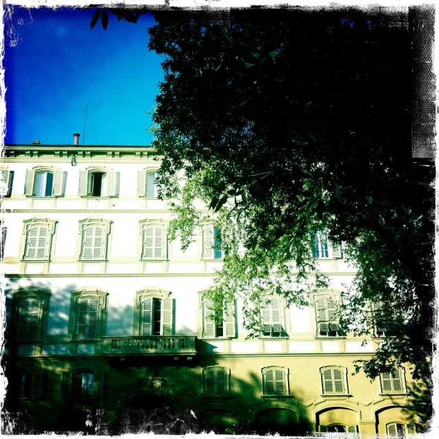 a white building with balconies and windows