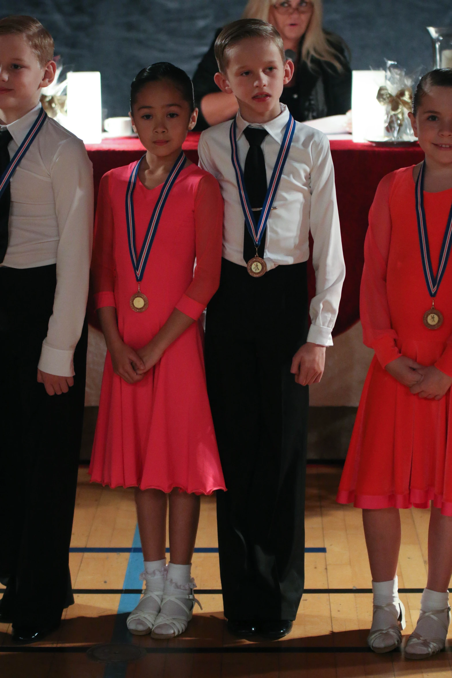 several s dressed in school uniforms, all with medals