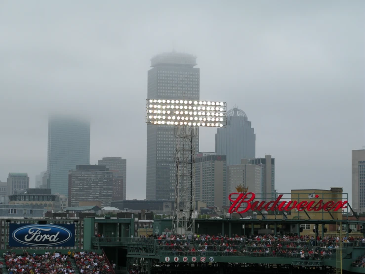 there is a huge crowd in front of a giant building