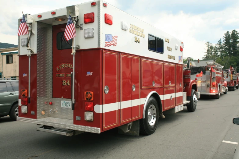 several fire trucks are parked beside one another