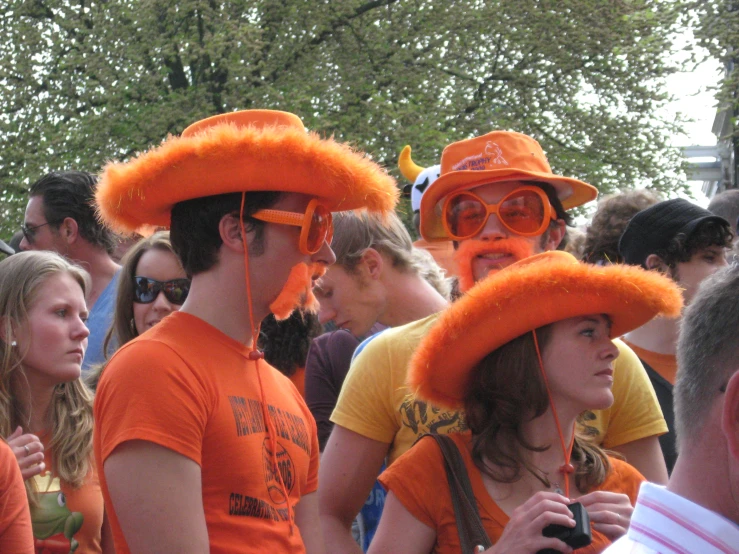 an image of people wearing orange hats
