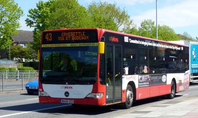 two buses are parked next to each other