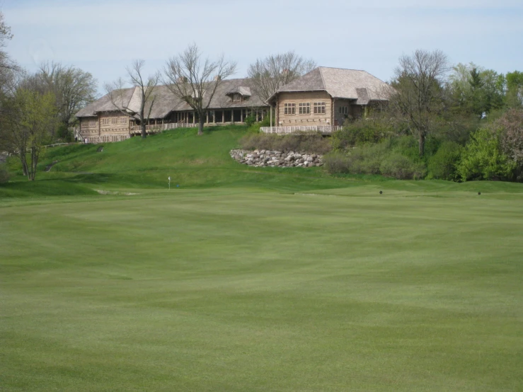 some houses near a golf course and a green