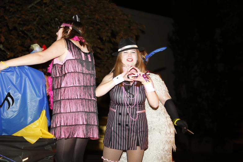 two women dressed up with hats, a costume and glasses