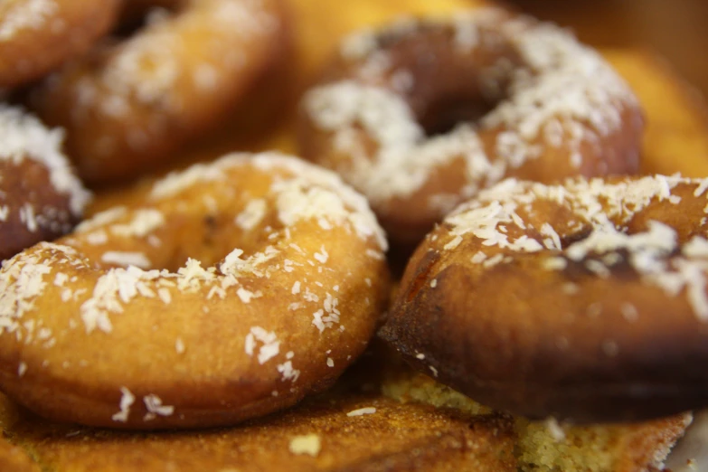 close up of different kinds of doughnuts on display