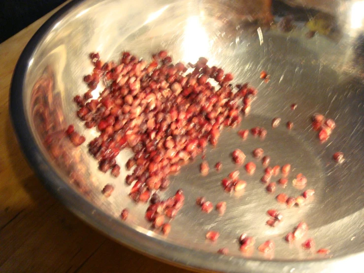 red beans are fried in an oil on a pan