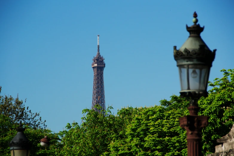 the top of a tall building in a wooded area