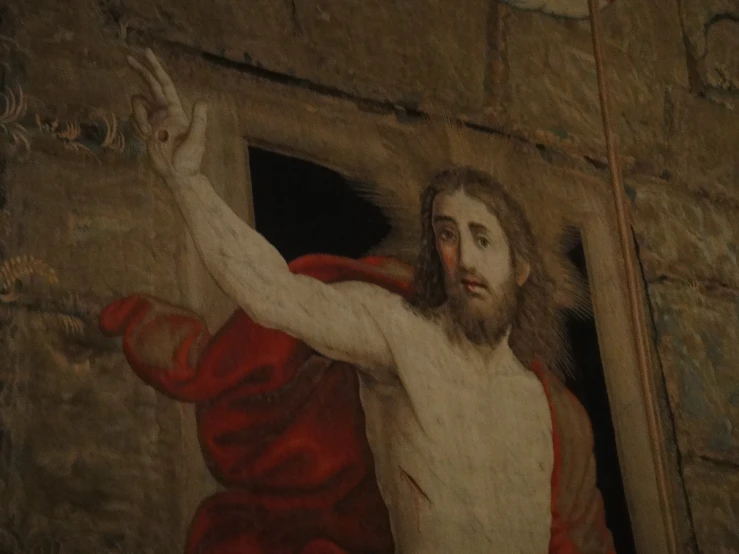 the image shows a painting of jesus hanging out of the window