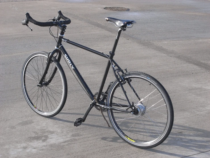 a bike that is on the concrete of the street