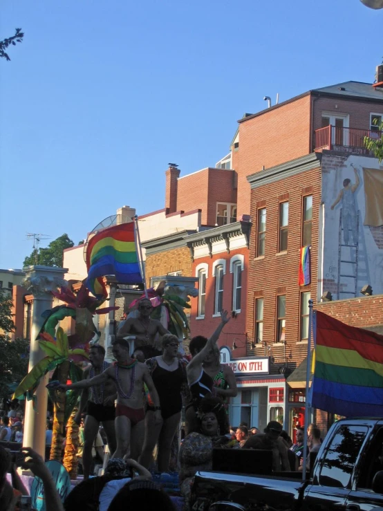 a parade float with gay pride on a city street