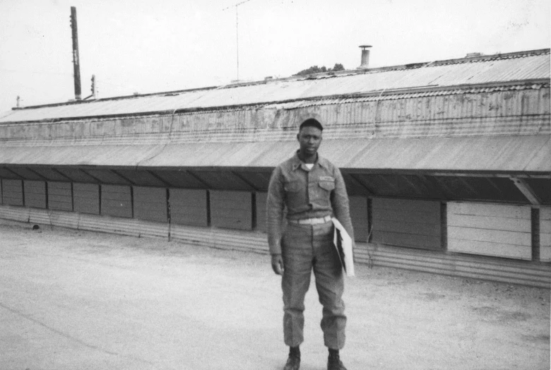 a man is standing on a parking lot