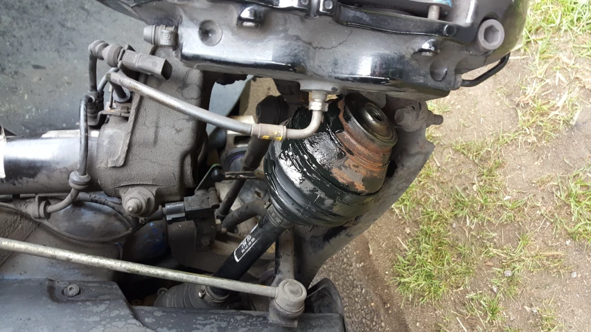 an open engine compartment with a yellow and brown piece of machinery