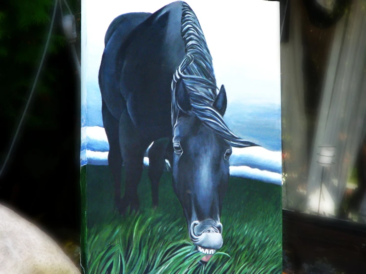 two black horses in grassy field painting by man