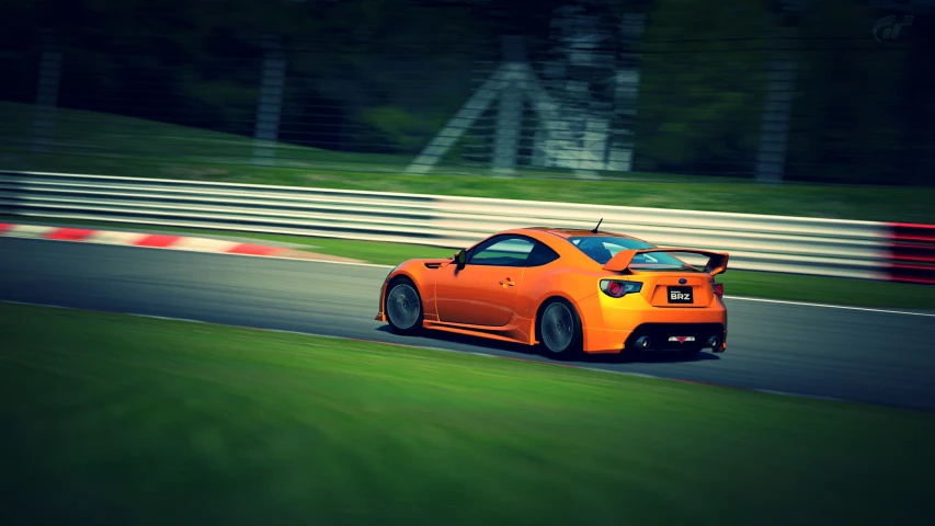 an orange sports car is on a racing track