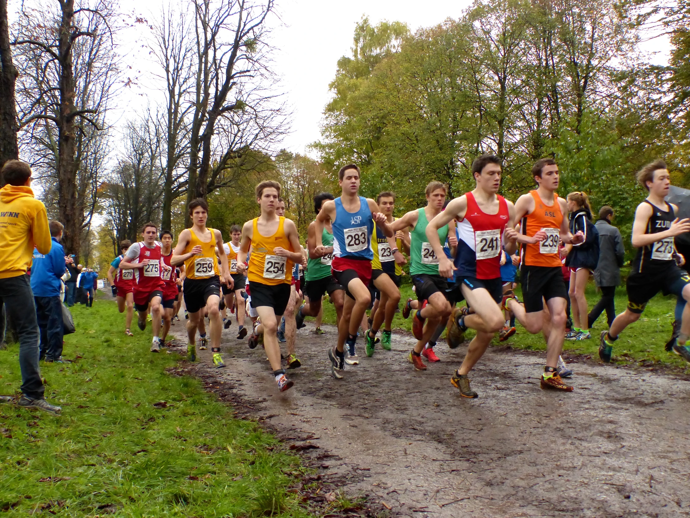 a group of men running in a competition