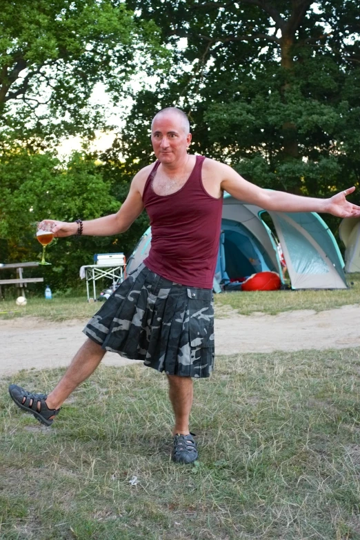 a young man stretching his arms with two hands