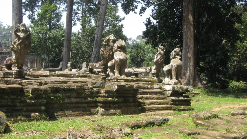 an outdoor sculpture is displayed in a park