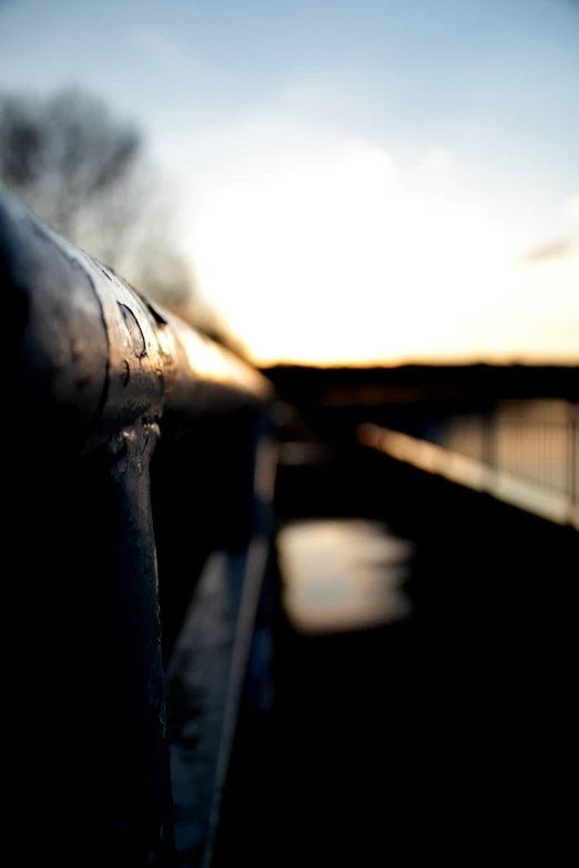 a pipe next to a body of water