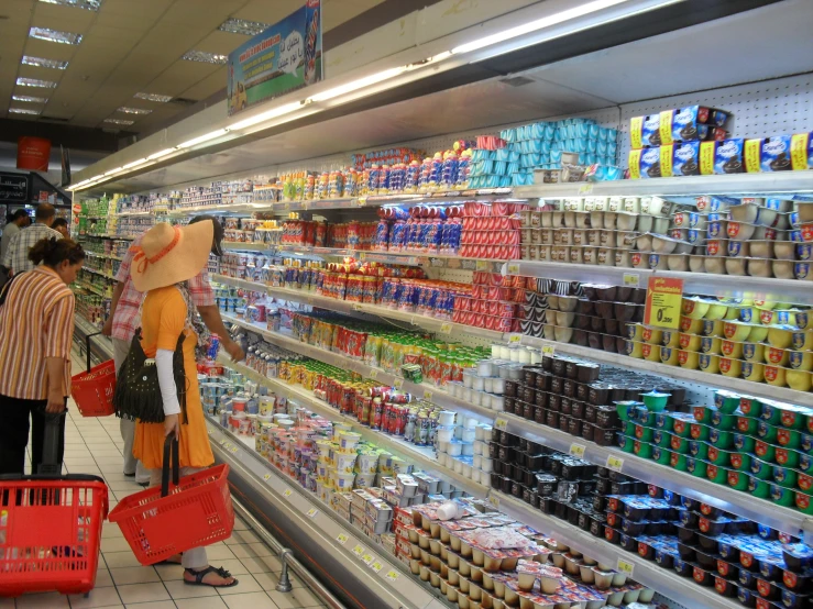 a couple of people shopping for items in a store